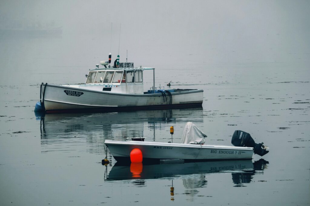 Lobster boats in calm Maine fog